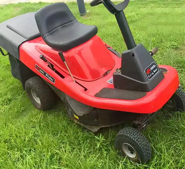 Riding lawn mower with bagger for sale